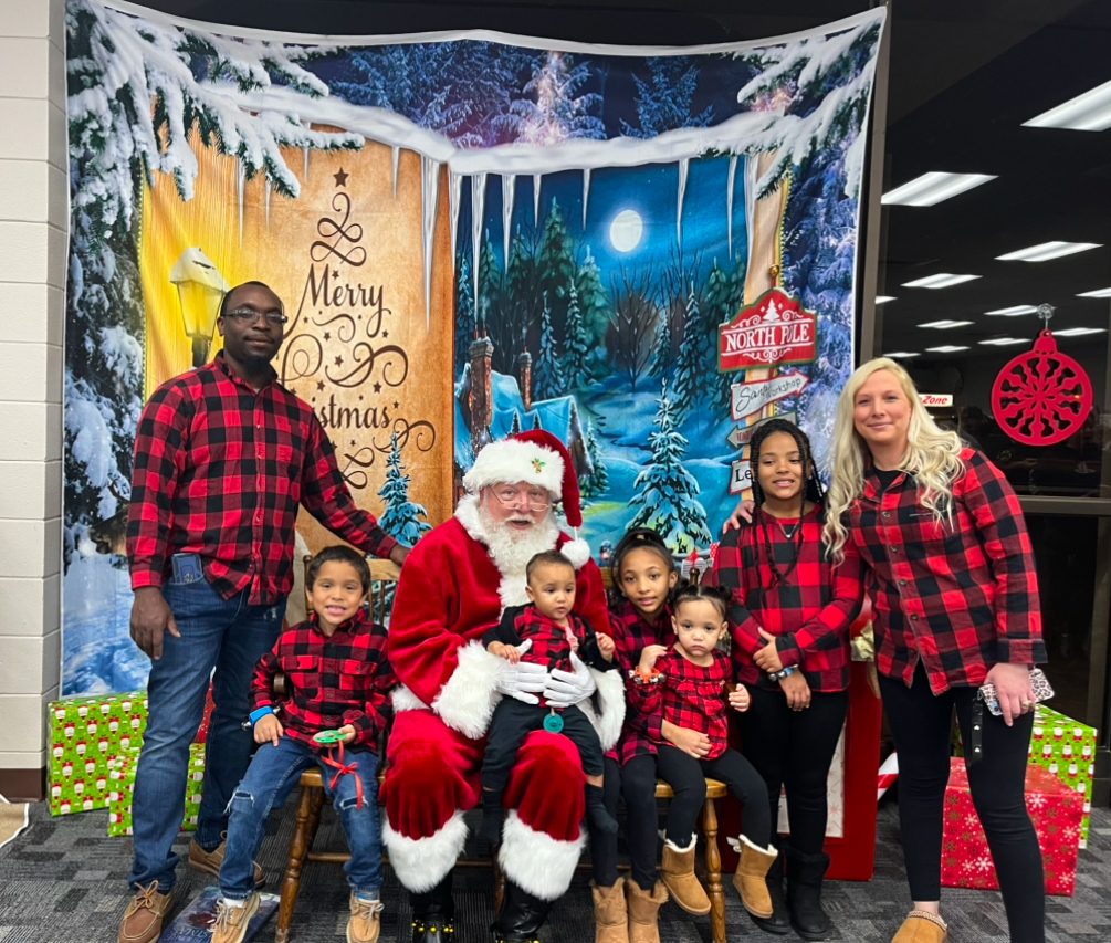 Family taking photos with Santa